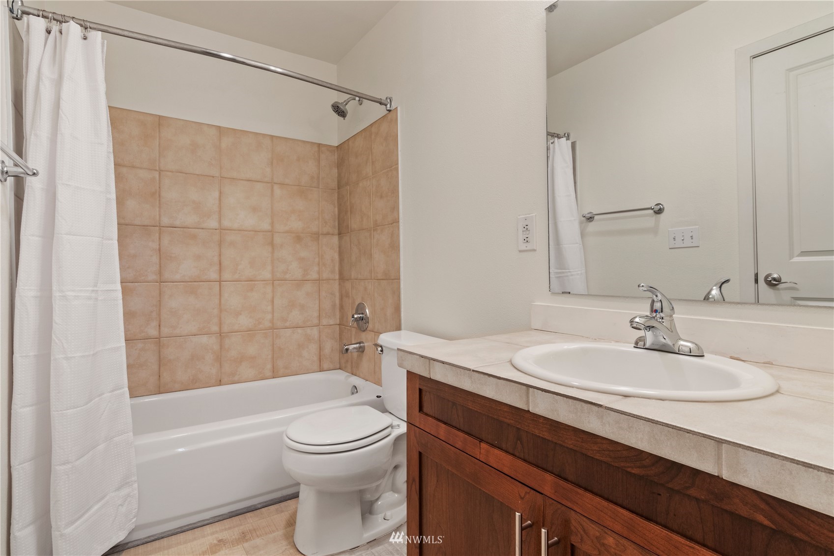 3901 243rd Place Southeast, Unit O102 Bothell, WA 98021 - Photo 25 of 32 a bathroom with a sink a toilet and shower
