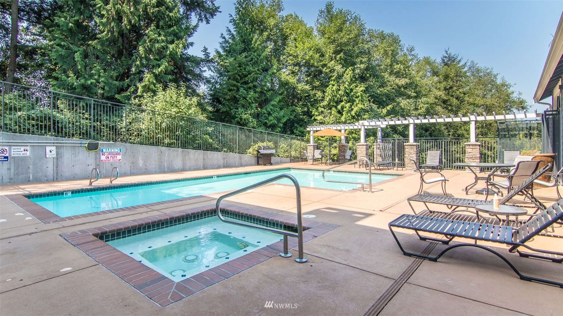 3901 243rd Place Southeast, Unit O102 Bothell, WA 98021 - Photo 28 of 32 a view of a chairs and tables in the back yard