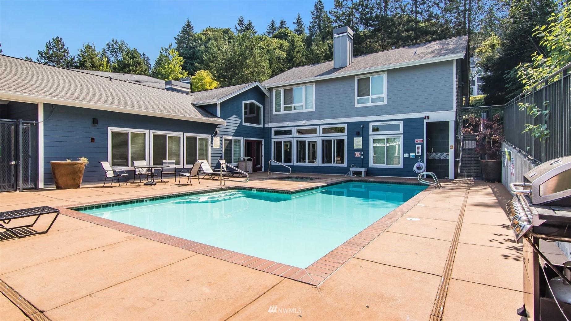 3901 243rd Place Southeast, Unit O102 Bothell, WA 98021 - Photo 29 of 32 a view of a house with swimming pool and sitting area