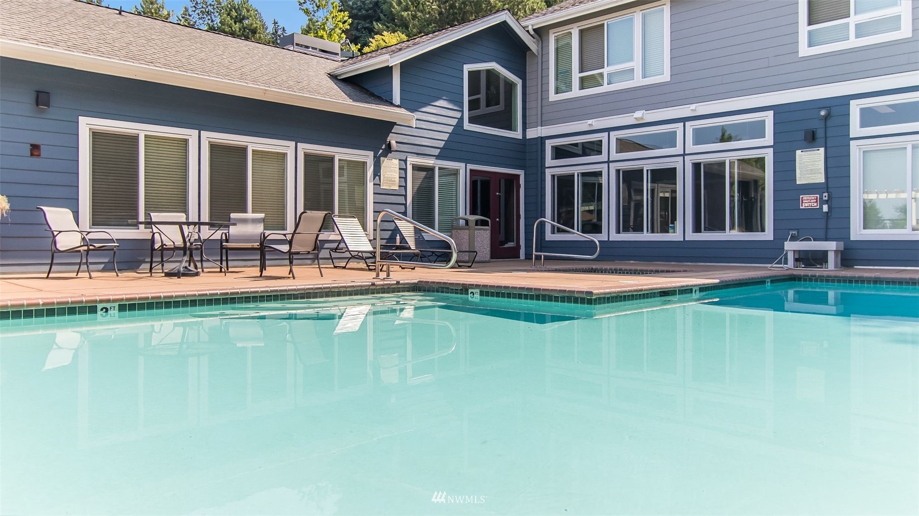 3901 243rd Place Southeast, Unit O102 Bothell, WA 98021 - Photo 30 of 32 a house view with swimming pool in front of it