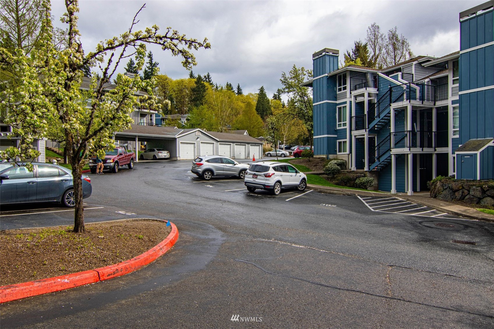 3901 243rd Place Southeast, Unit O102 Bothell, WA 98021 - Photo 3 of 32 a view of street with parked cars