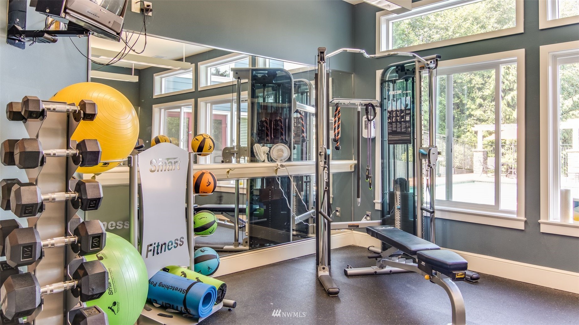 3901 243rd Place Southeast, Unit O102 Bothell, WA 98021 - Photo 31 of 32 a room with gym equipment and a large window