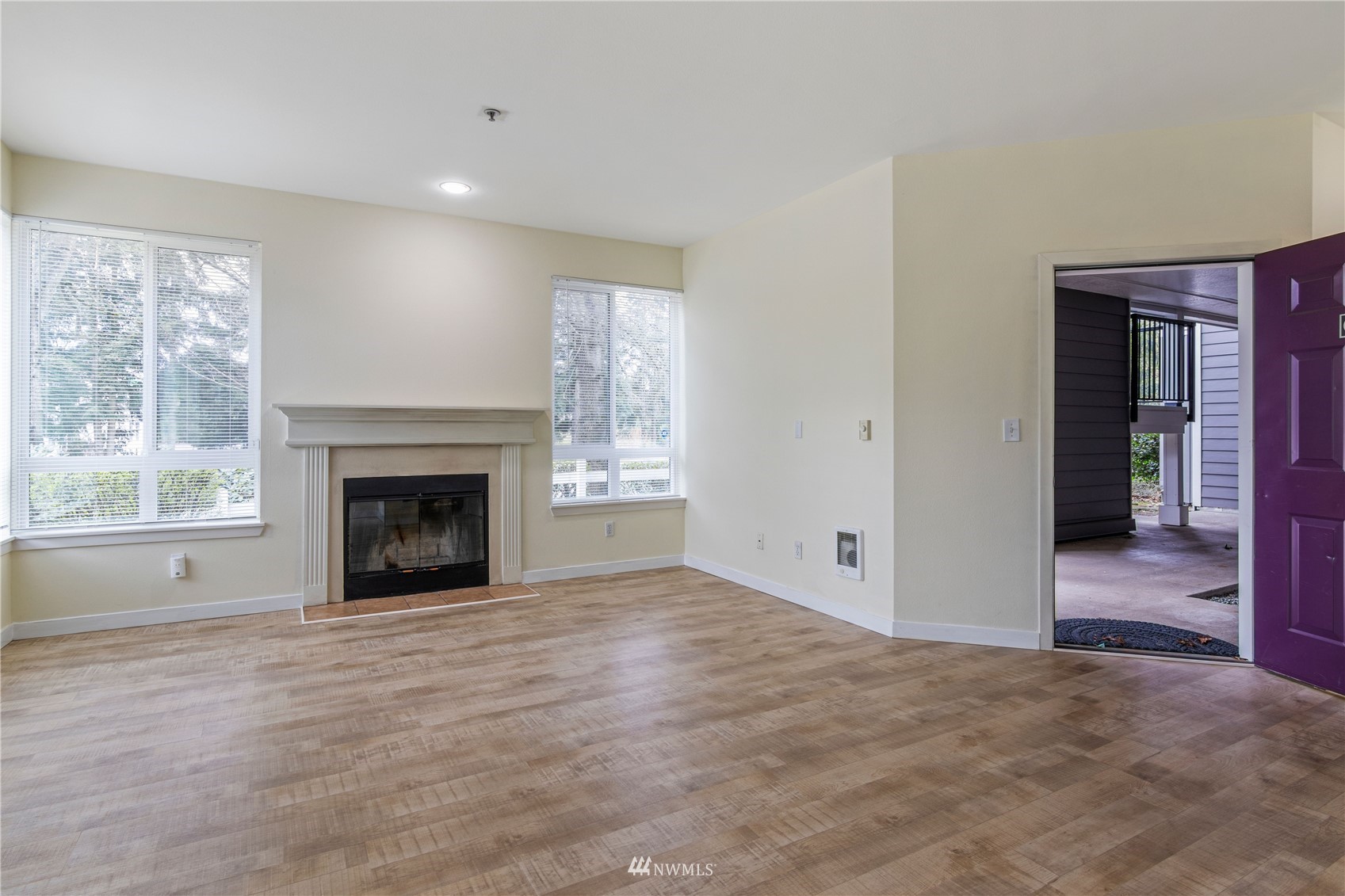 3901 243rd Place Southeast, Unit O102 Bothell, WA 98021 - Photo 7 of 32 a view of an empty room with a window and fireplace