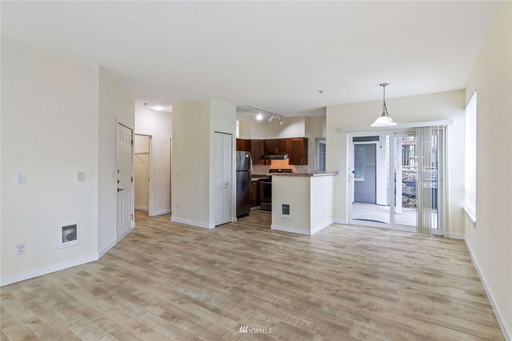 3901 243rd Place Southeast, Unit O102 Bothell, WA 98021 - Photo 10 of 32 a view of a kitchen with a sink cabinets and wooden floor