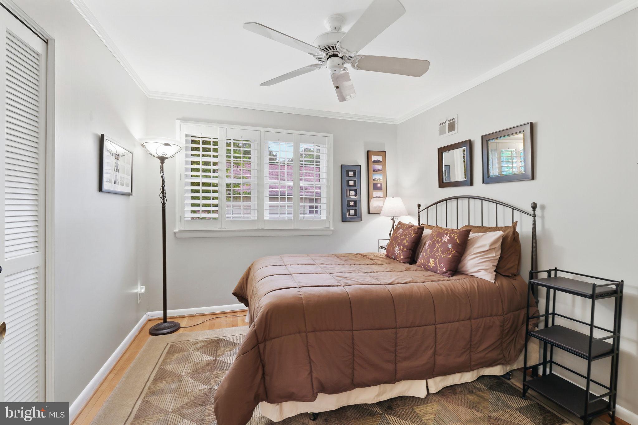 8815 Postoak Road Potomac, MD 20854 - Photo 27 of 45 a bedroom with a large bed and a window