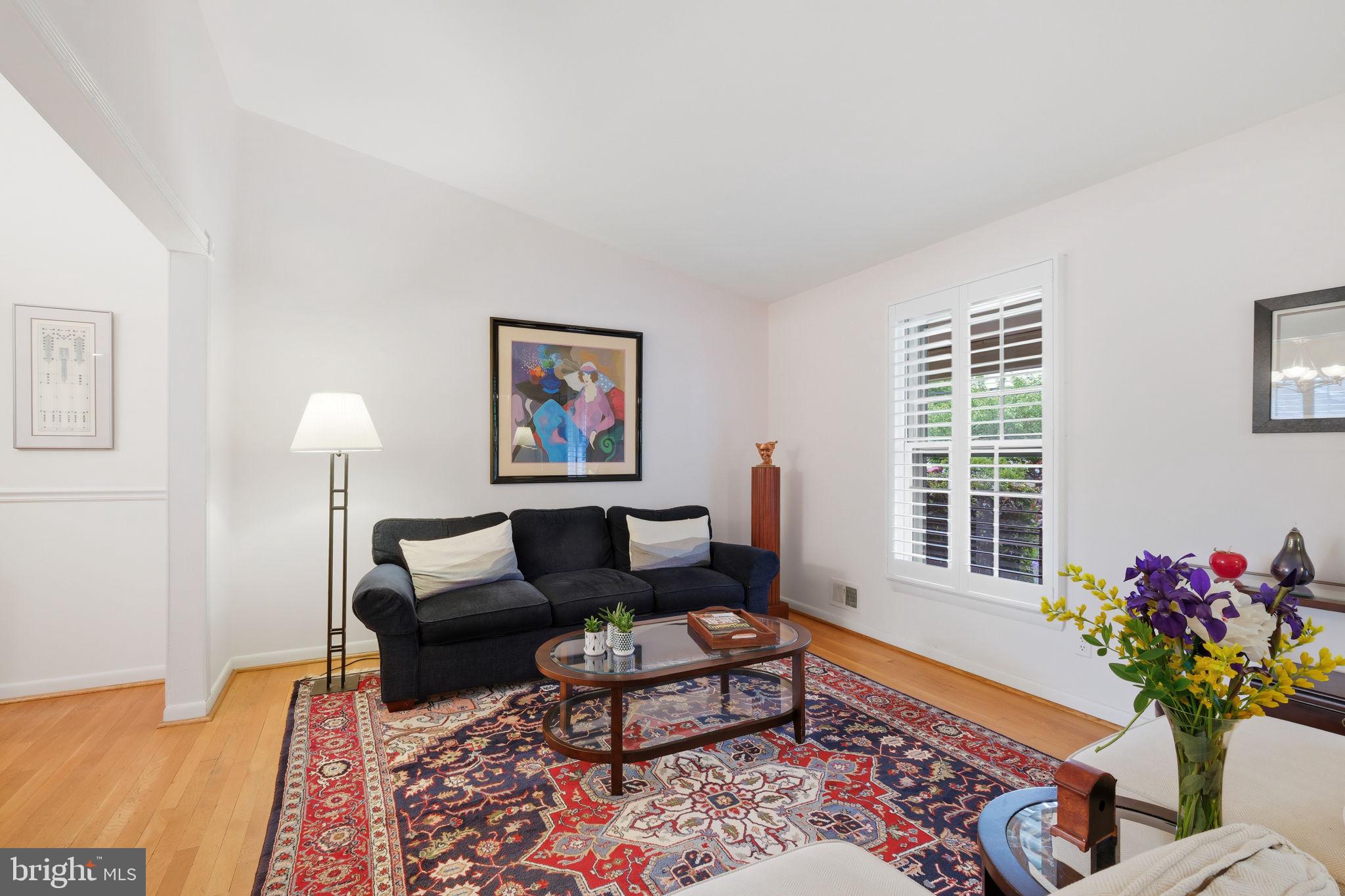 8815 Postoak Road Potomac, MD 20854 - Photo 8 of 45 a living room with furniture plant and a window