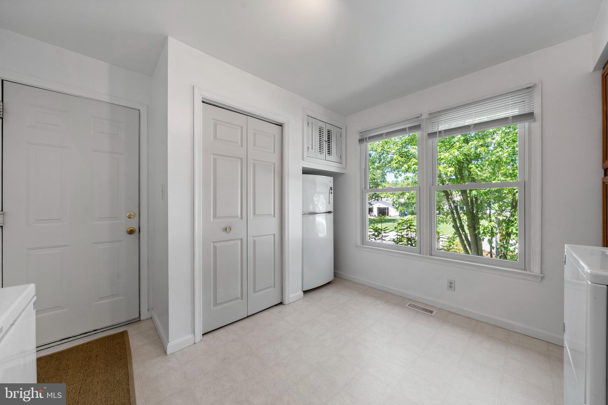 13555 South View Road Newburg, MD 20664 - Photo 26 of 74 Laundry room with pantry, fridge & door to garage