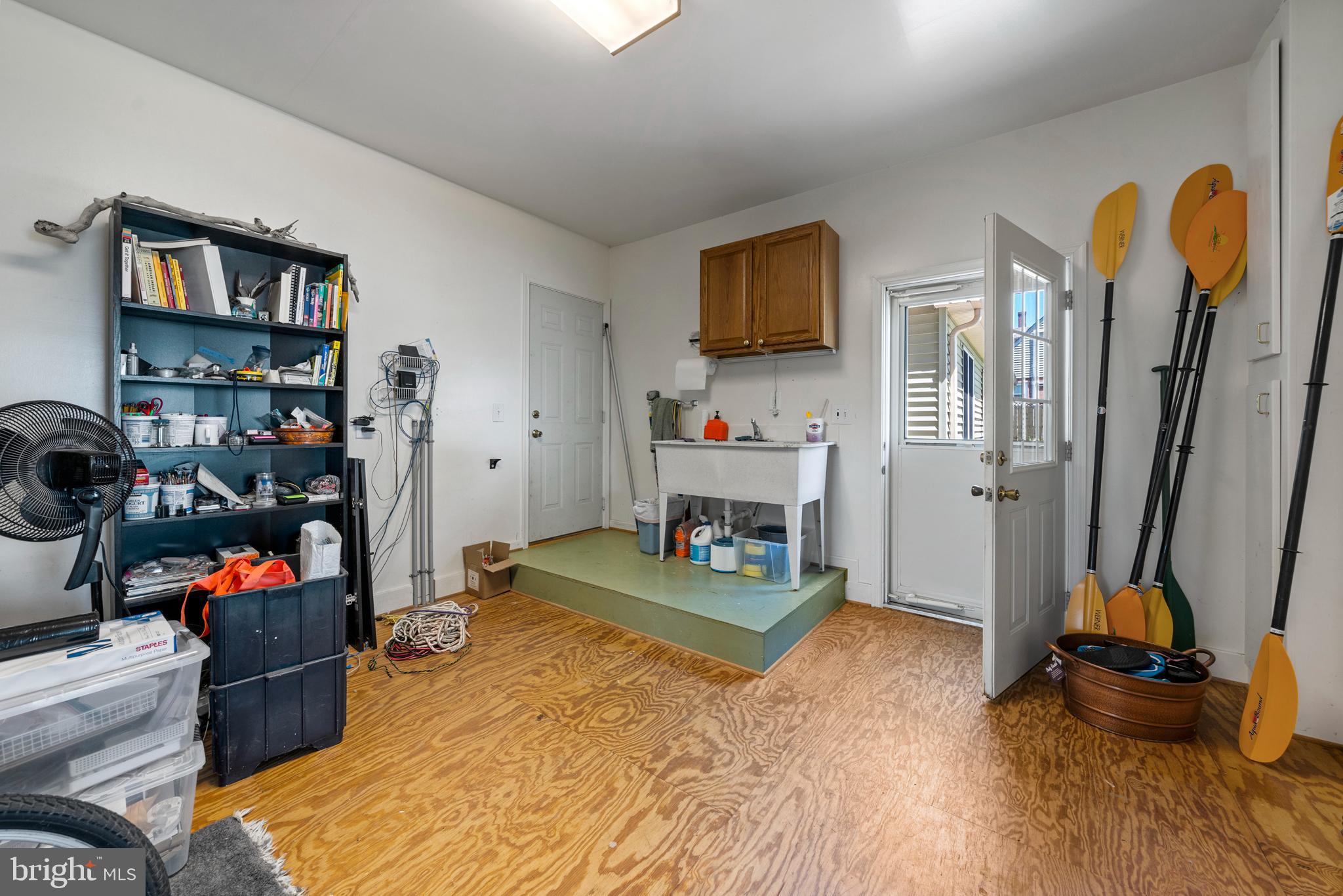 13555 South View Road Newburg, MD 20664 - Photo 51 of 74 Storage room w/ washing sink and door to deck