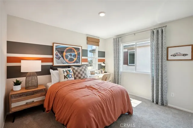 a bedroom with a bed and a night stand