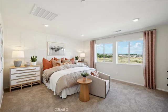 a bed room with a bed and a window