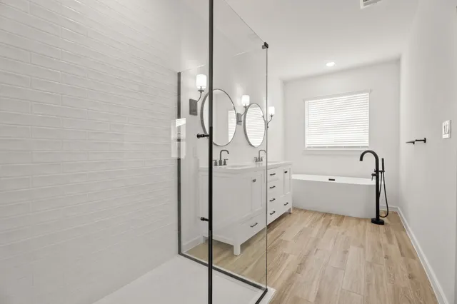 a bathroom with a bathtub and a sink