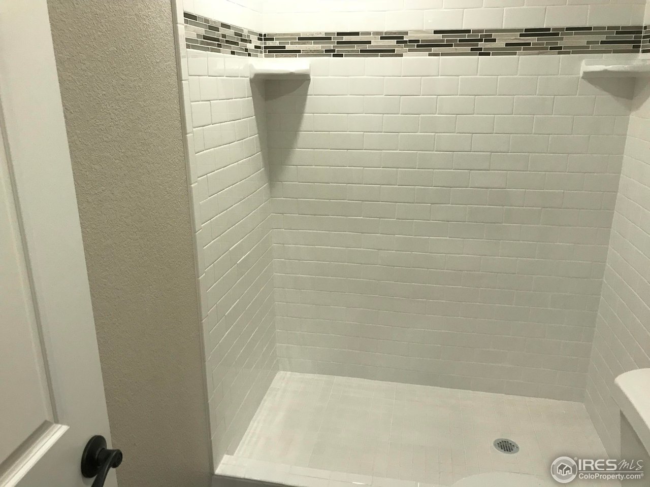 1065 Modred Street Lafayette, CO 80026 - Photo 11 of 23 a bathroom with a shower