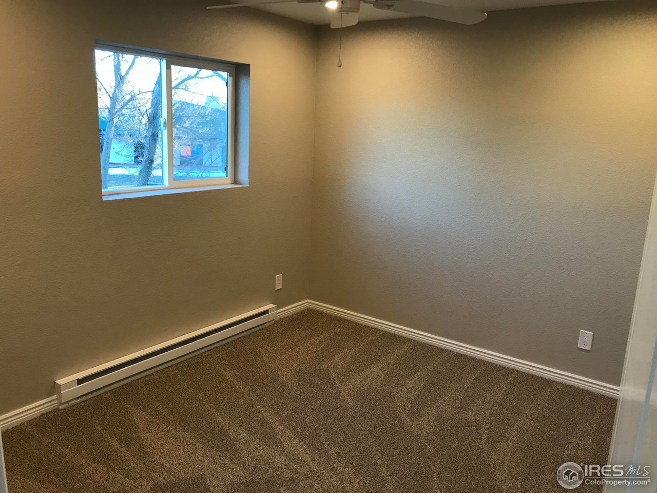 1065 Modred Street Lafayette, CO 80026 - Photo 19 of 23 an empty room with a window