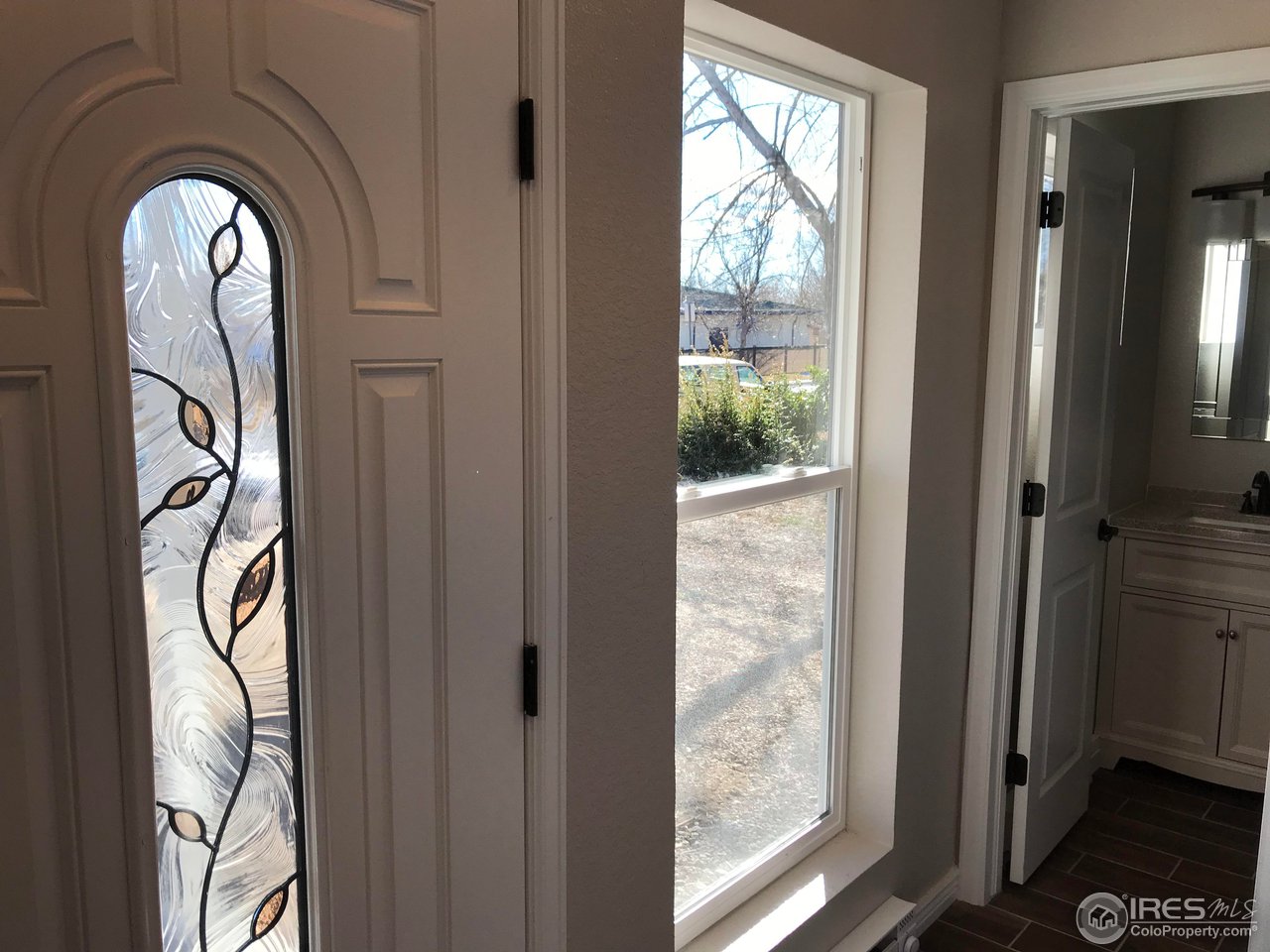 1065 Modred Street Lafayette, CO 80026 - Photo 5 of 23 a view of front door with wooden floor