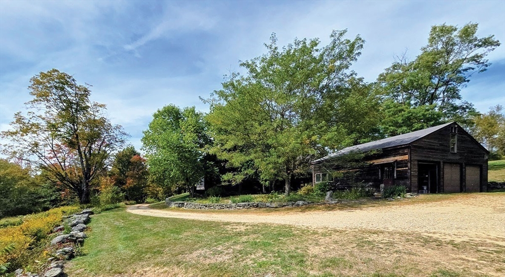 47 Harty Drive Petersham, MA 01366 - Photo 3 of 39 a front view of a house with a yard