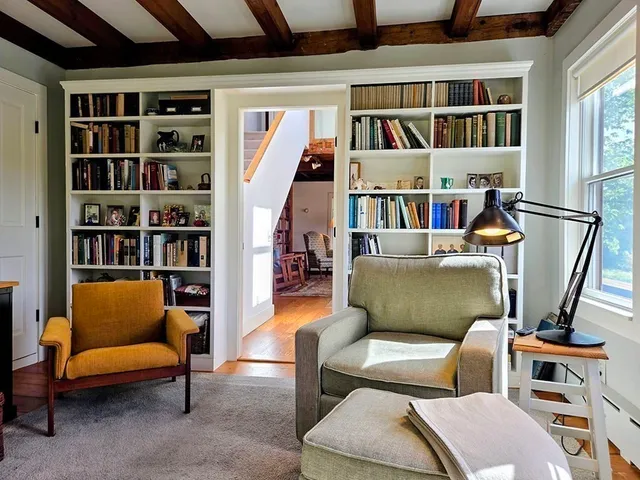a room with furniture and a book shelf