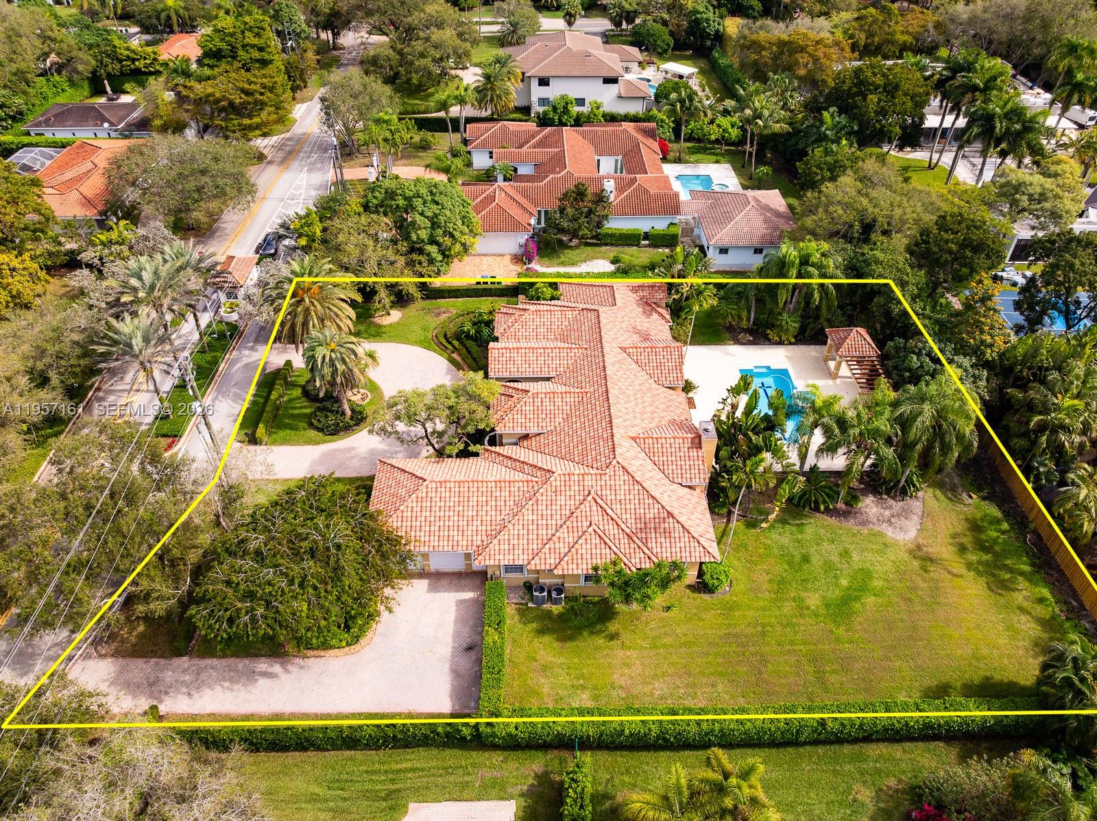 5770 Southwest 128th Street Pinecrest, FL 33156 - Photo 31 of 37 an aerial view of residential houses with outdoor space