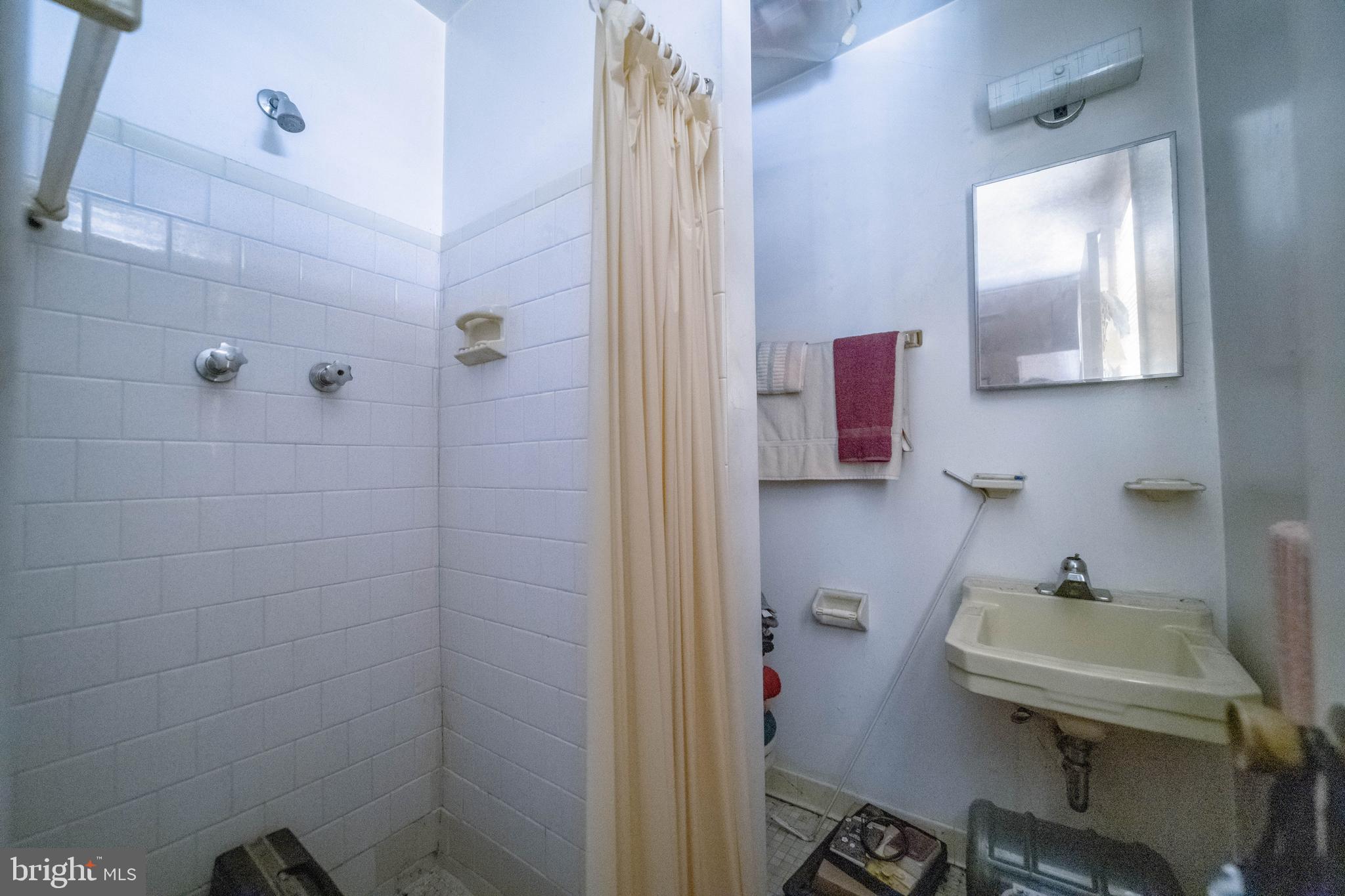 6900 Temple Hill Road Temple Hills, MD 20748 - Photo 32 of 43 a bathroom with a sink a toilet and shower
