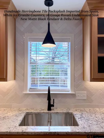 a kitchen with a window a sink and a cabinets