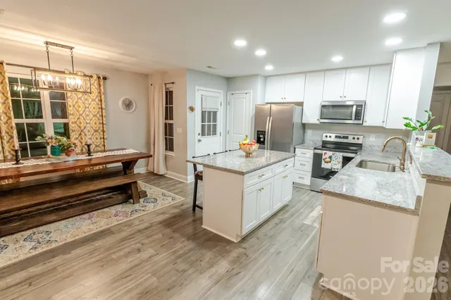 a kitchen with a sink stove and refrigerator