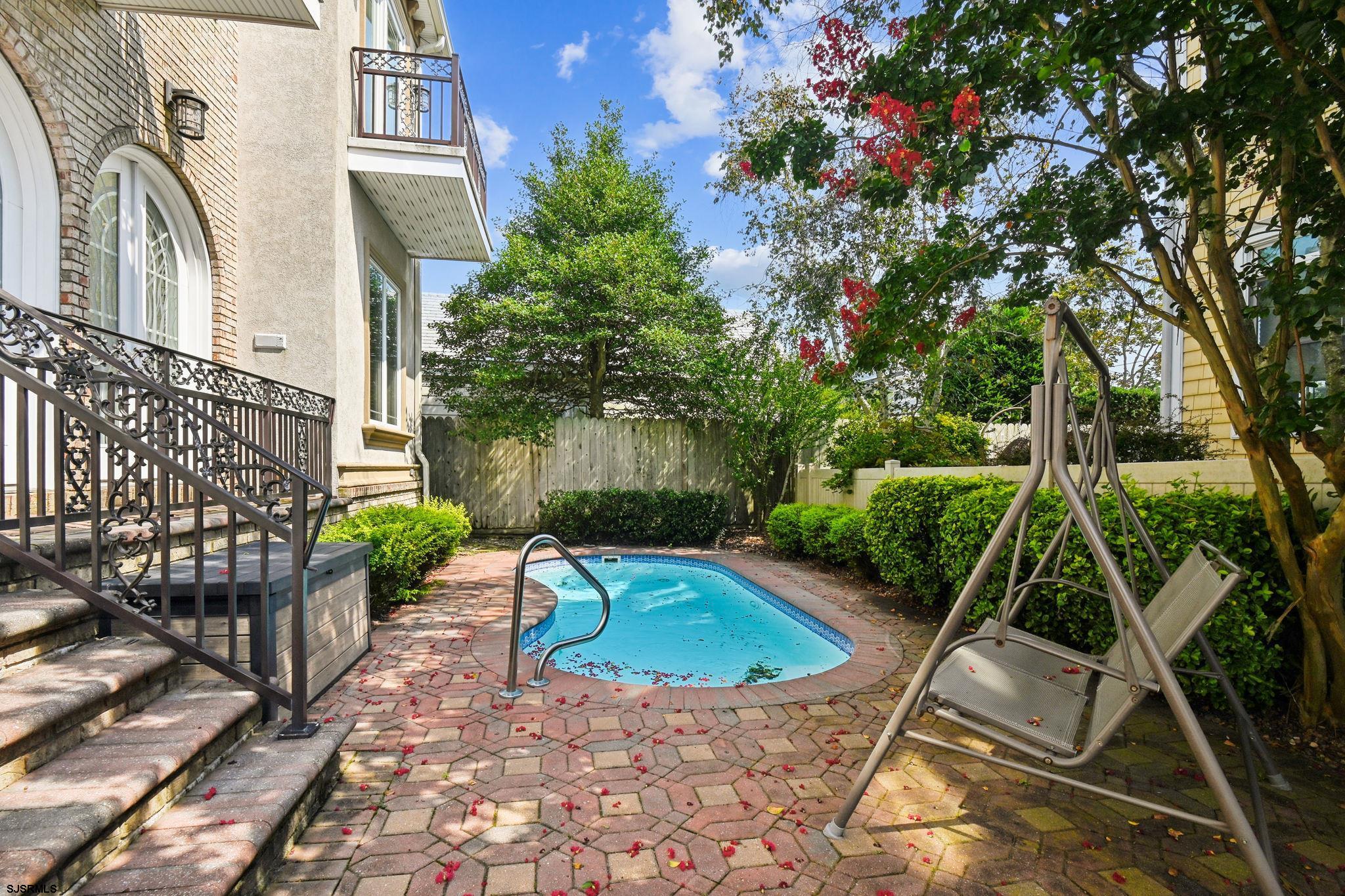 301 Wesley Road Ocean City, NJ 08226 - Photo 19 of 44 a view of a chair and table in the patio