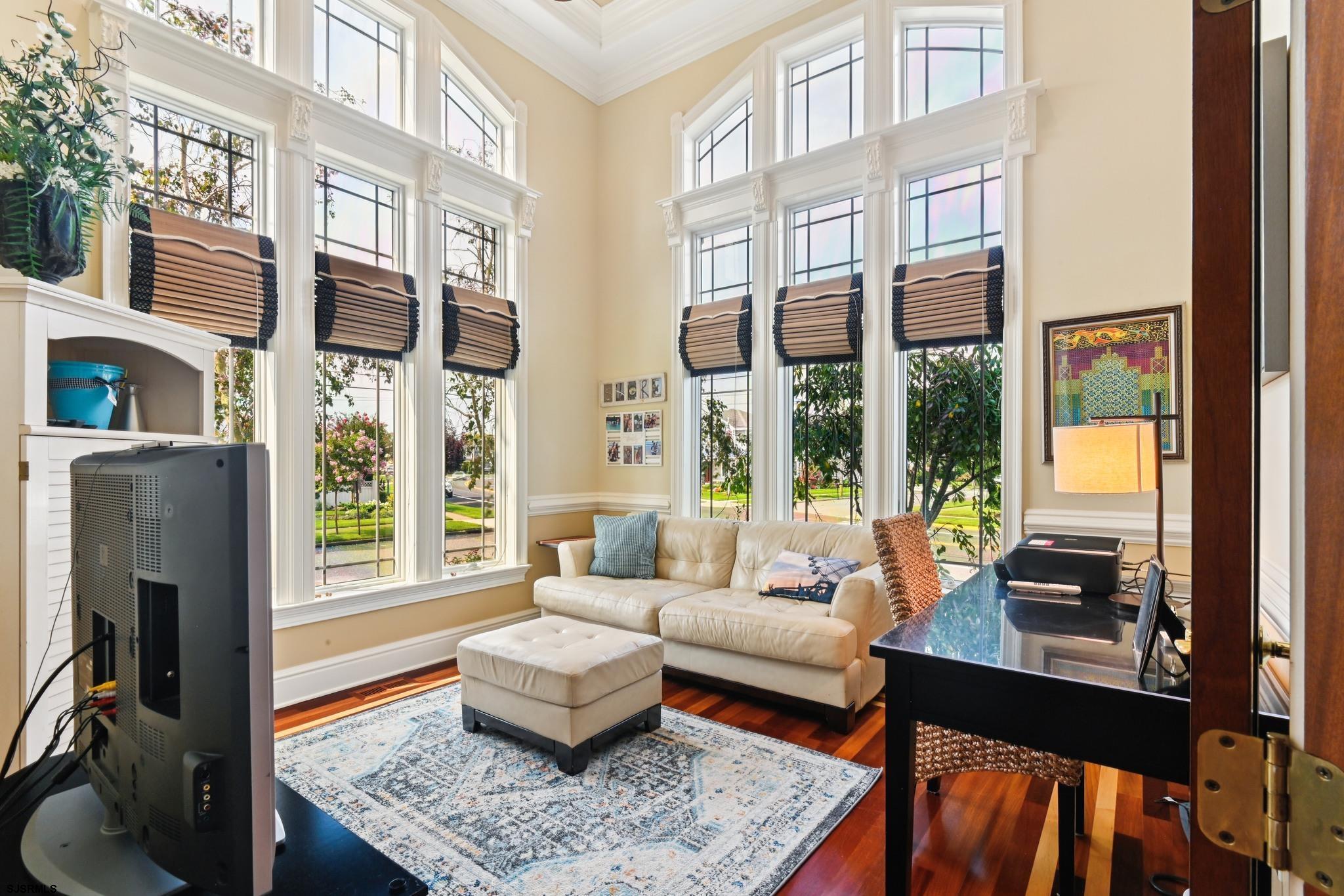 301 Wesley Road Ocean City, NJ 08226 - Photo 29 of 44 a living room with furniture fireplace and a large window