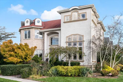 a front view of a house with garden