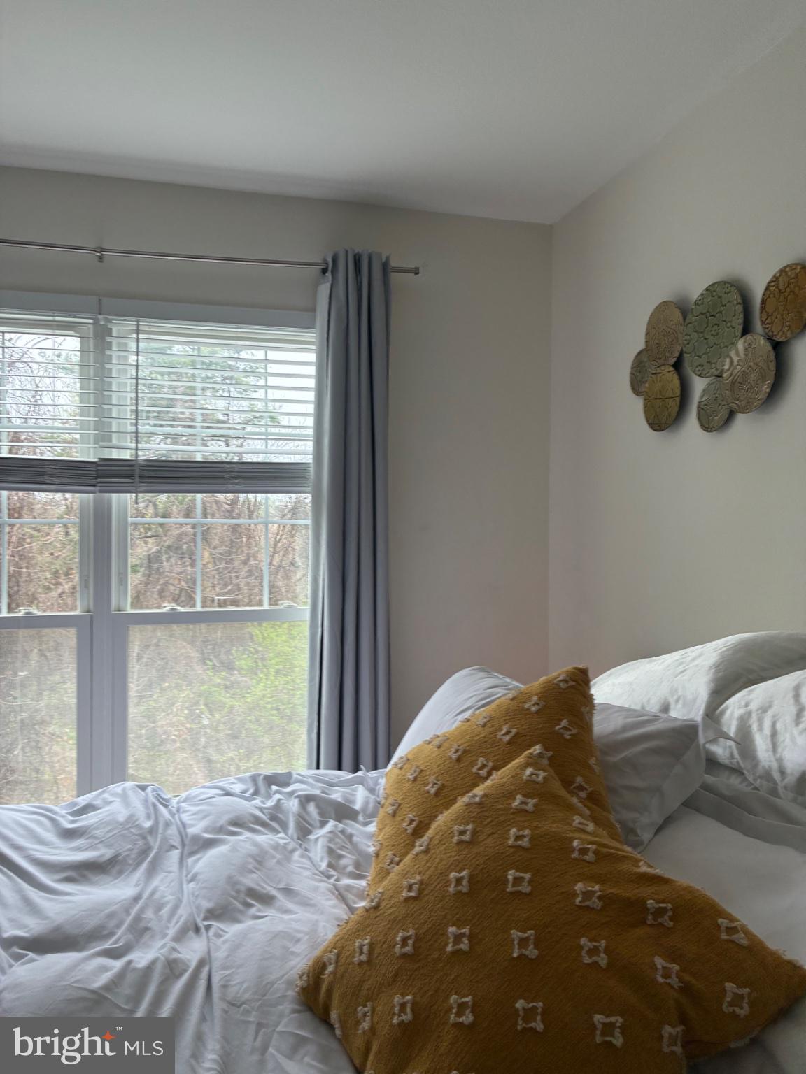 1571 Spring Gate Dr., Unit 6206 McLean, VA 22102 - Photo 22 of 26 Serene bedroom with natural light.