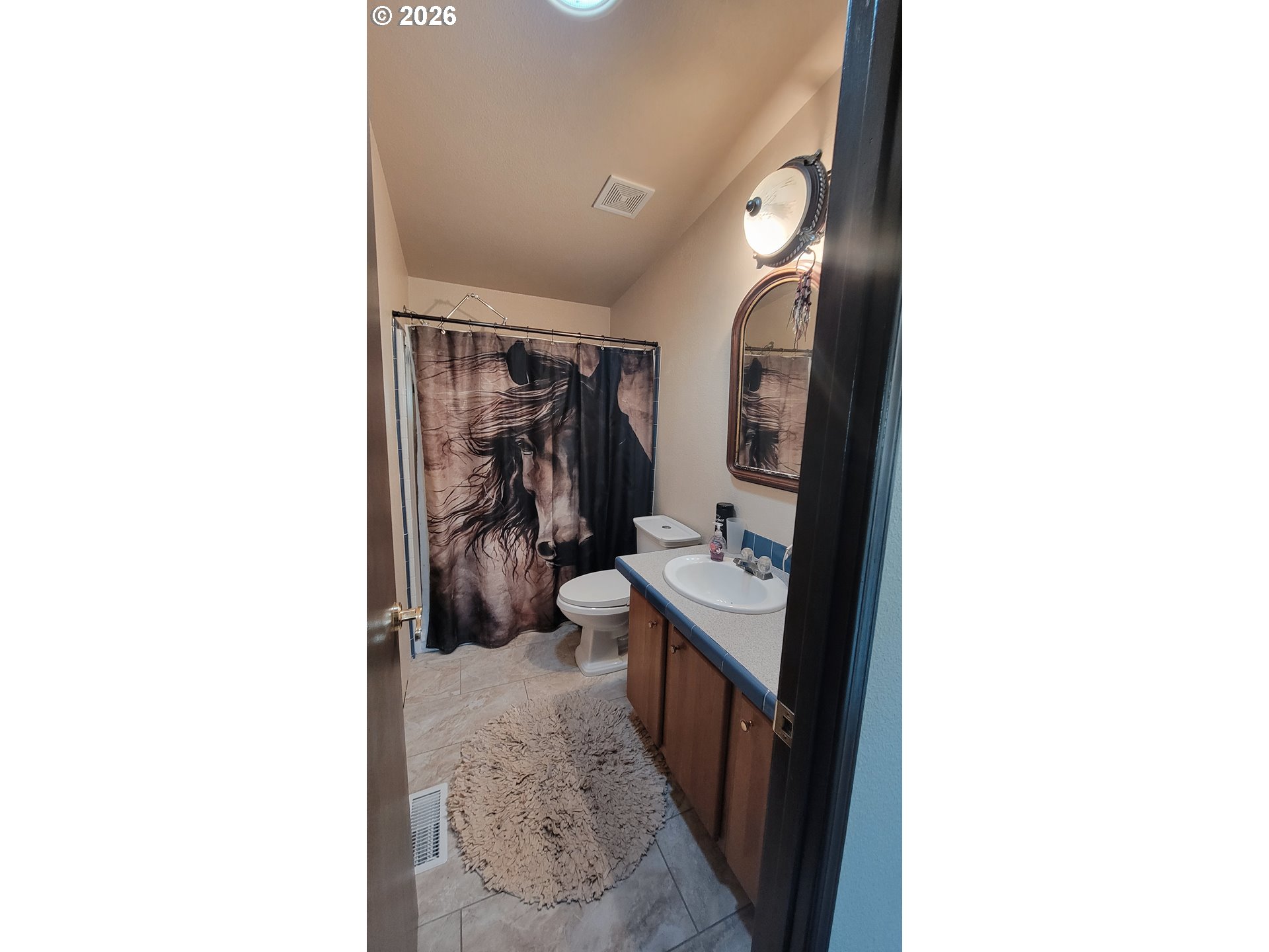 514 Eakin Road Azalea, OR 97410 - Photo 4 of 41 a en suite bathroom with a sink and mirror