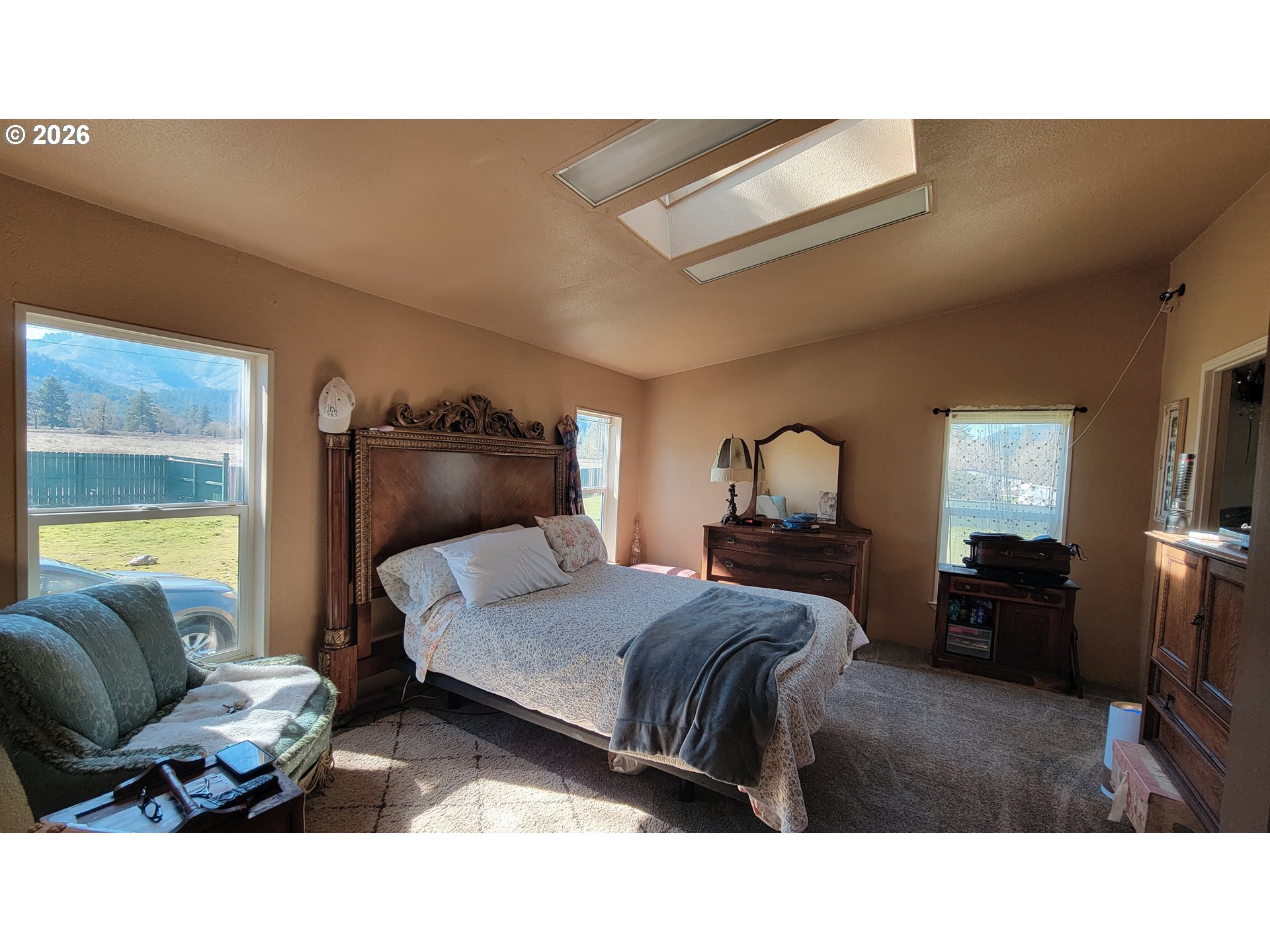 514 Eakin Road Azalea, OR 97410 - Photo 10 of 41 a bedroom with a bed window and couch