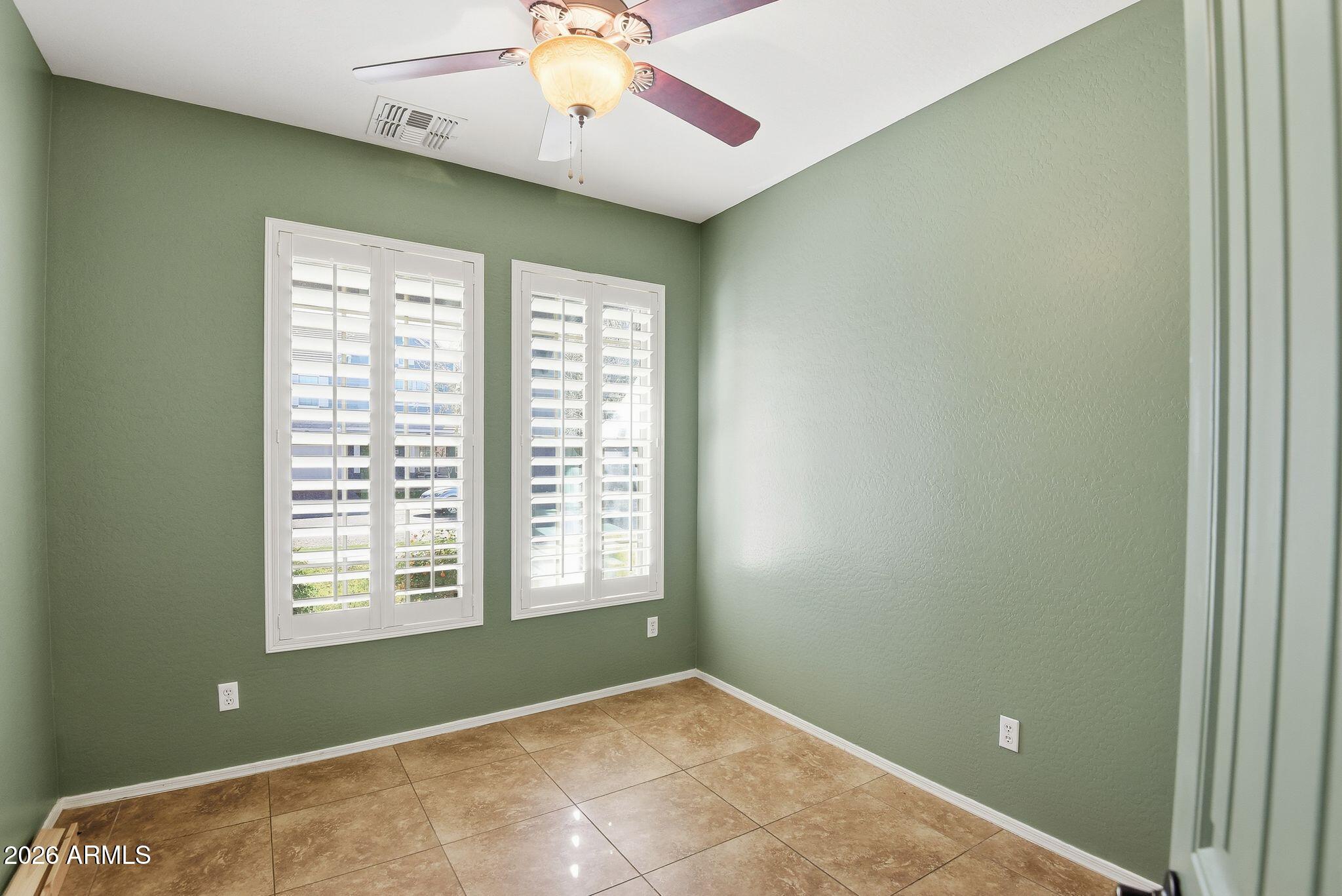 3484 East Mesquite Street Gilbert, AZ 85296 - Photo 11 of 16 an empty room with windows