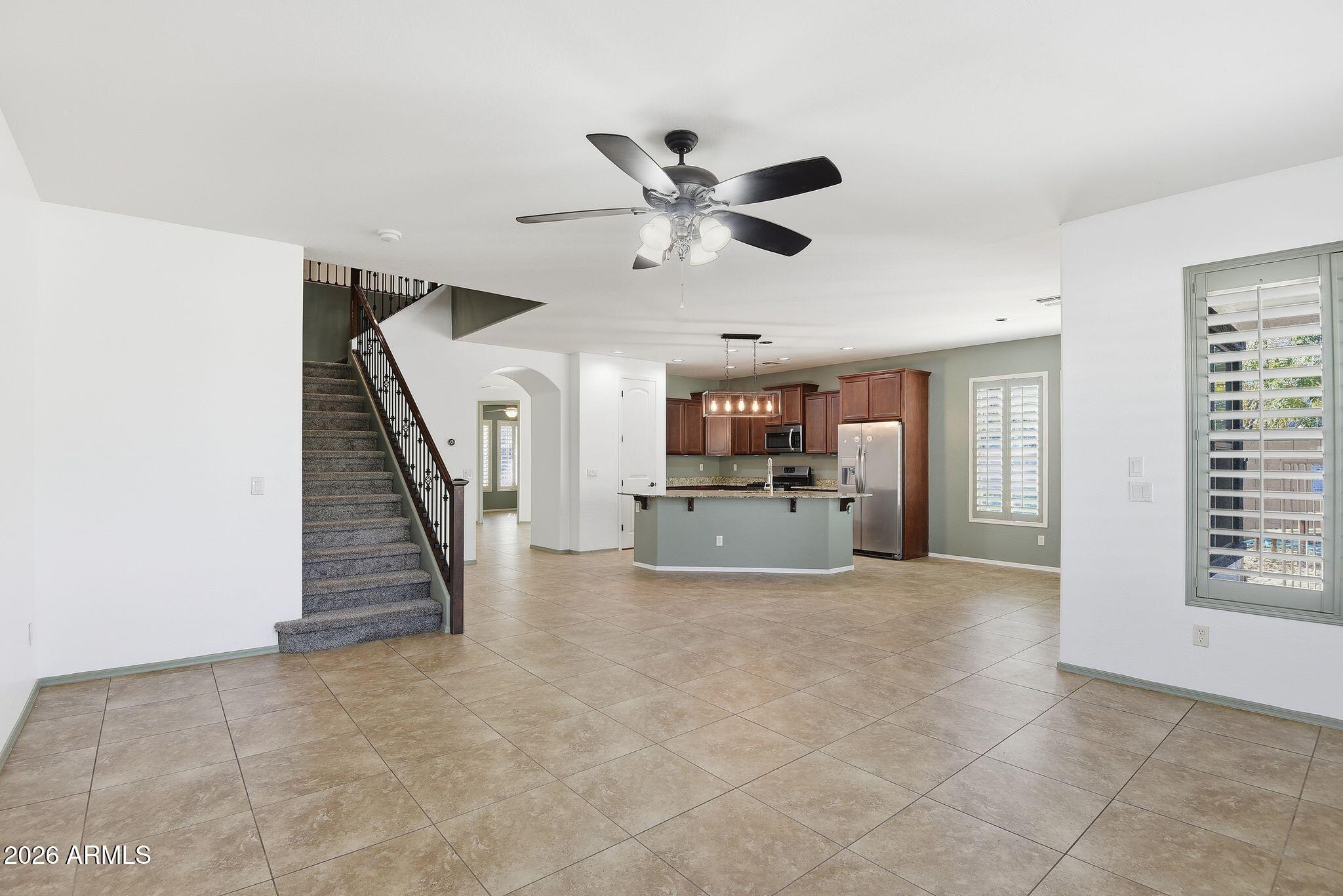 3484 East Mesquite Street Gilbert, AZ 85296 - Photo 2 of 16 a view of a livingroom with a ceiling fan and window