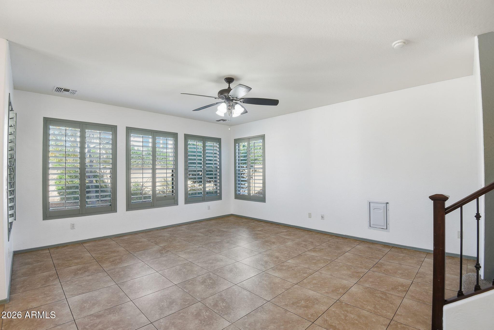 3484 East Mesquite Street Gilbert, AZ 85296 - Photo 3 of 16 a view of an empty room with a window