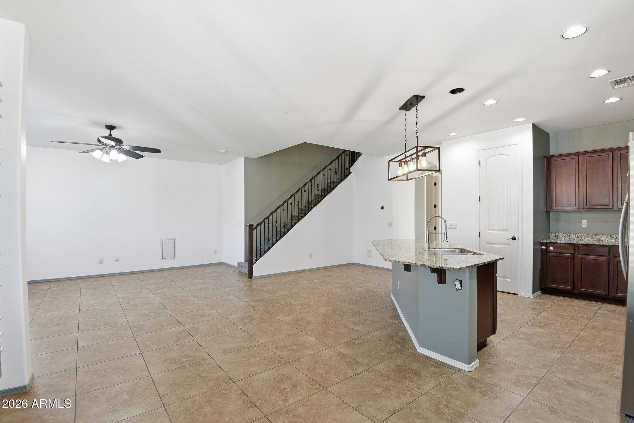 3484 East Mesquite Street Gilbert, AZ 85296 - Photo 7 of 16 a view of kitchen and kitchen with sink