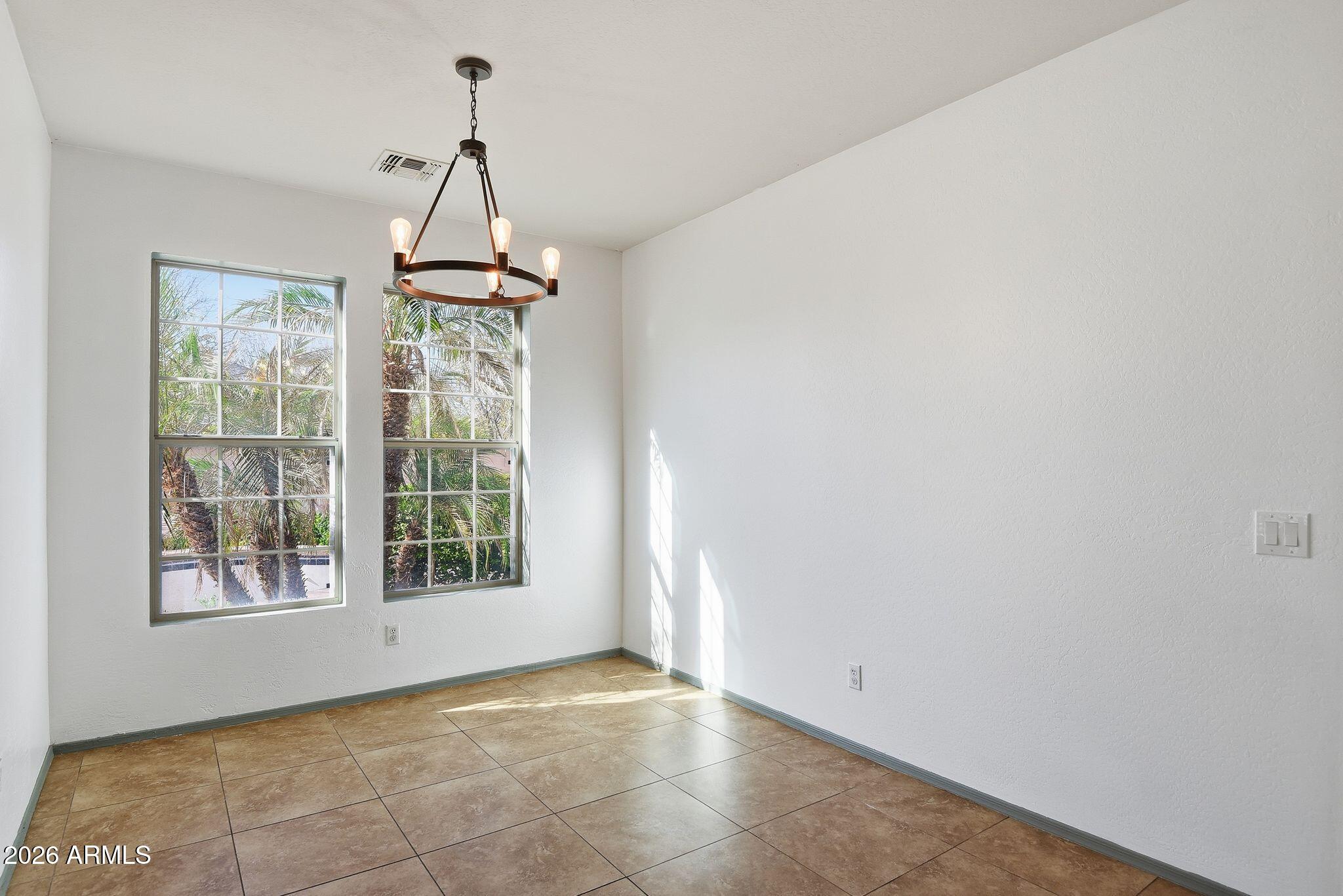 3484 East Mesquite Street Gilbert, AZ 85296 - Photo 9 of 16 a view of an empty room with a window