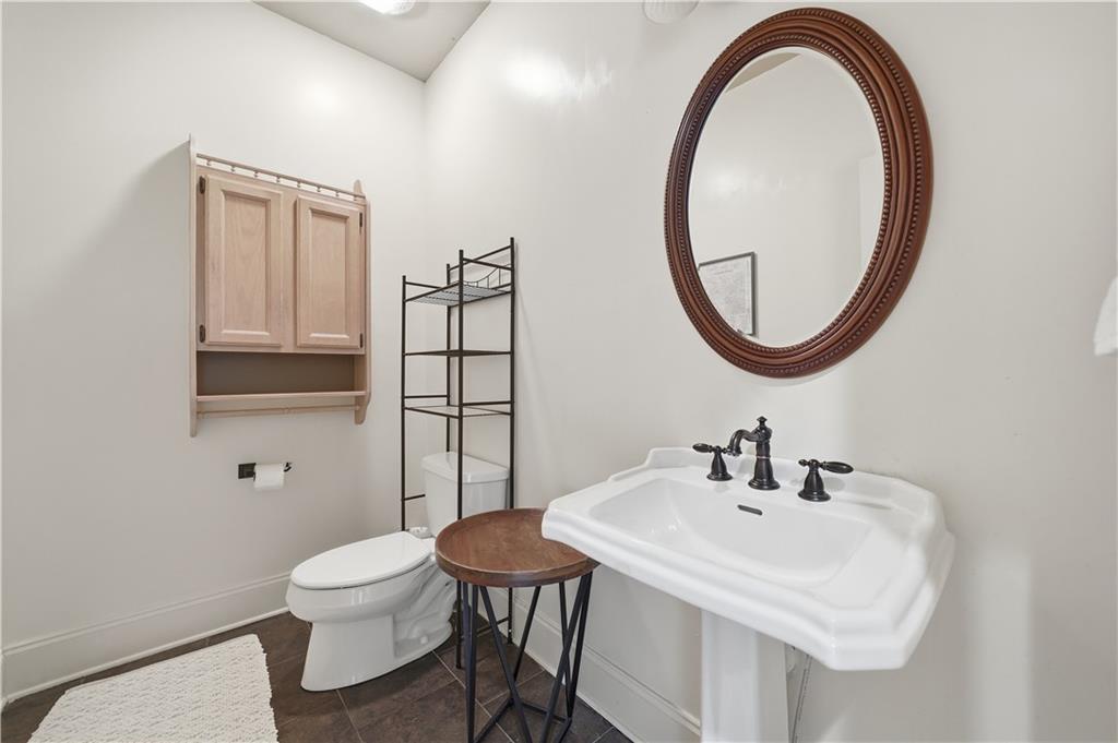 97 Eagle Ridge Trail Cleveland, GA 30528 - Photo 58 of 58 a bathroom with a sink a toilet and a mirror