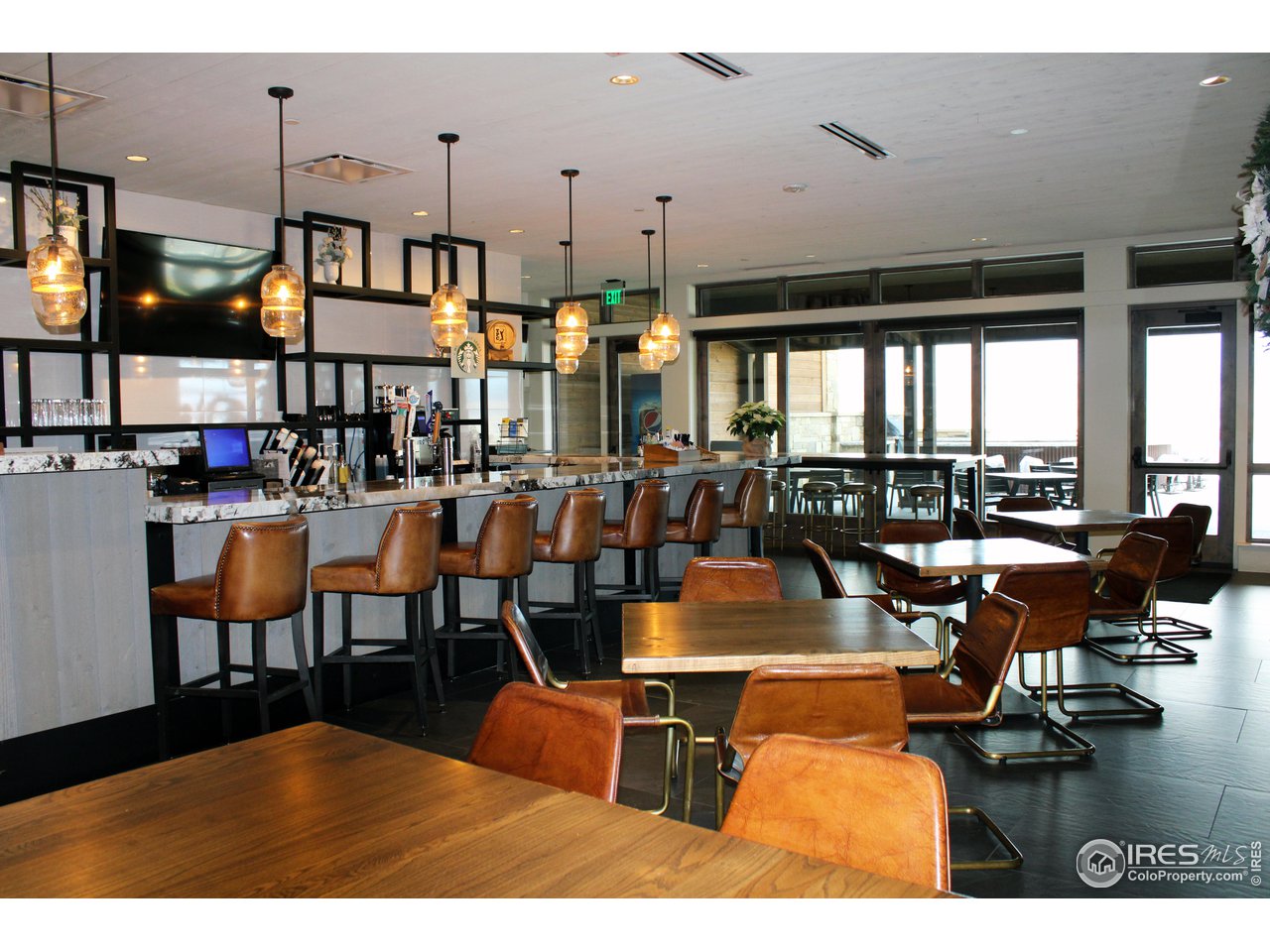 2575 Southwind Road Berthoud, CO 80513 - Photo 7 of 14 a living room with lots of furniture and a large window