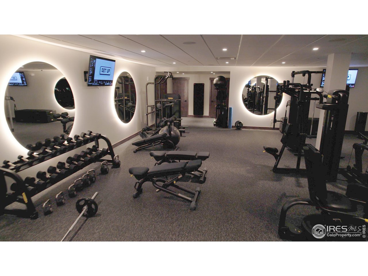 2575 Southwind Road Berthoud, CO 80513 - Photo 8 of 14 a living room with lots of gym equipment