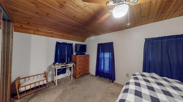 a bedroom with furniture and natural light