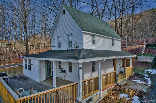 a front view of a house with parking space