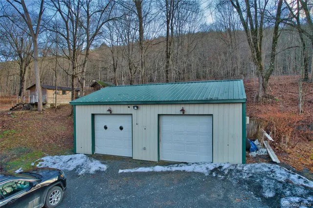 a view of a wooden door in the backyard
