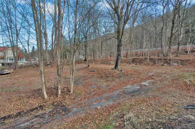 a wooden bench sitting in middle of forest