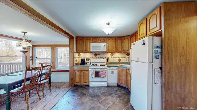 a kitchen with cabinets and stainless steel appliances