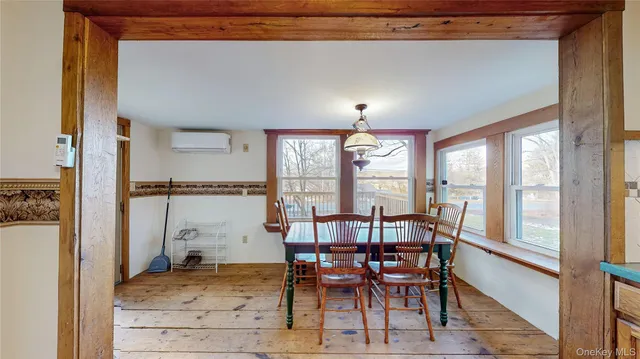 a view of a dining room with furniture window and outside view