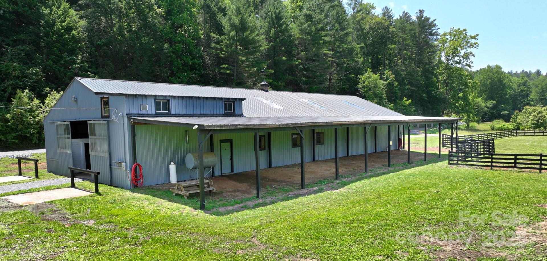 2941 Roby Martin Road Lenoir, NC 28645 - Photo 2 of 47 a view of a house with a yard and a large tree