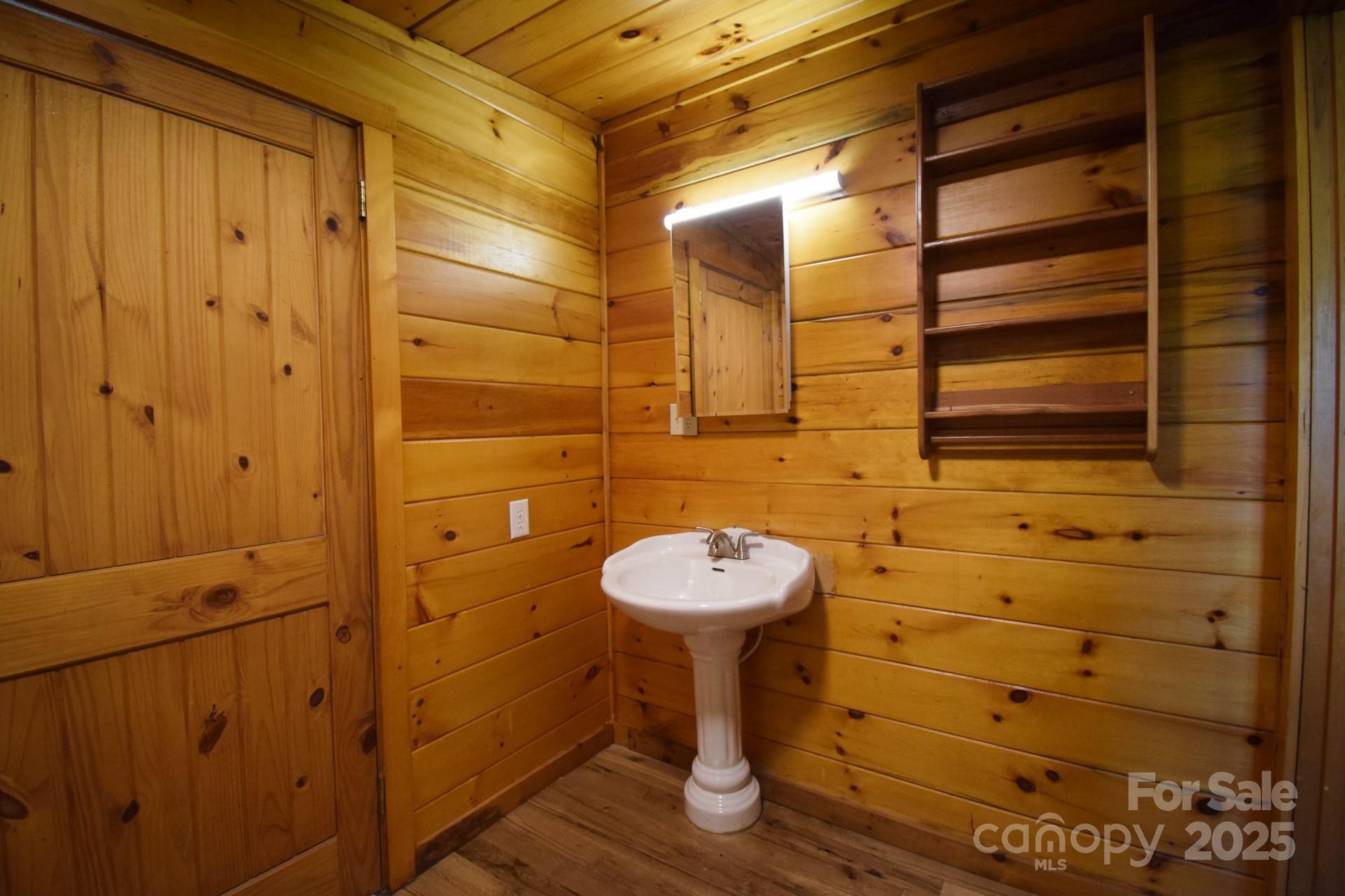 2941 Roby Martin Road Lenoir, NC 28645 - Photo 26 of 47 a bathroom with a sink and a mirror