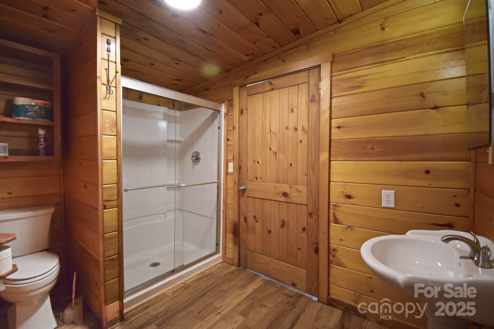 2941 Roby Martin Road Lenoir, NC 28645 - Photo 27 of 47 a bathroom with a sink toilet and shower