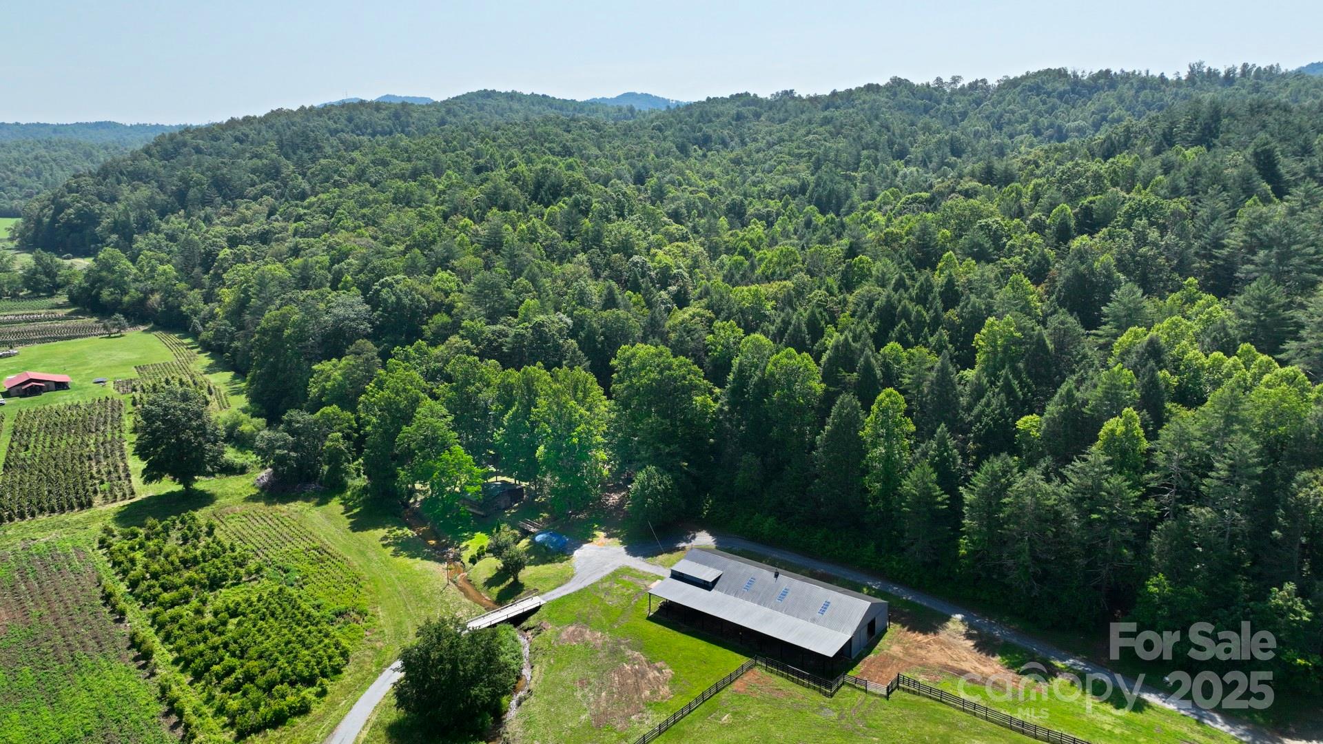 2941 Roby Martin Road Lenoir, NC 28645 - Photo 31 of 47 an aerial view of a house with a yard