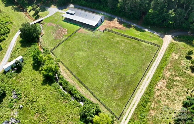 a view of a garden with a house