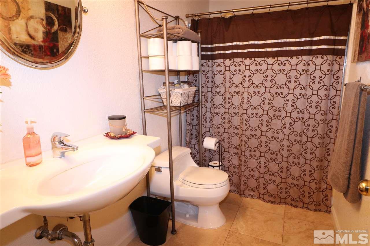 7658 Devonshire Lane Reno, NV 89511 - Photo 7 of 16 a bathroom with a toilet and a sink